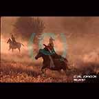 Cowboys riding horses at roundup